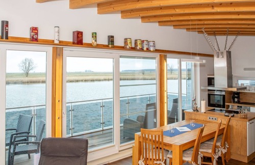 Kroeslin Boat Rental | 03. floating houses (105 m²) Hero - Floating house no. 7 with fireplace and pet