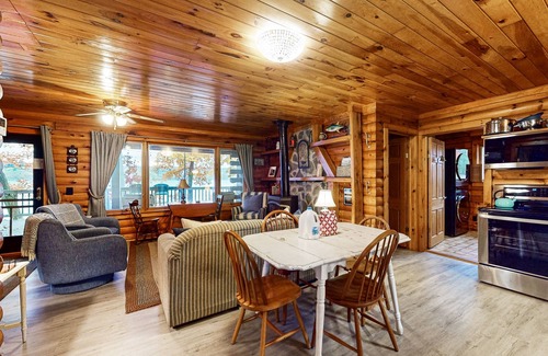 Valois House | 1-acre lakefront log cabin with dock, 50 ft water frontage, hot tub, & deck