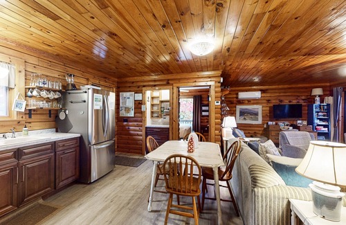 Valois House | 1-acre lakefront log cabin with dock, 50 ft water frontage, hot tub, & deck