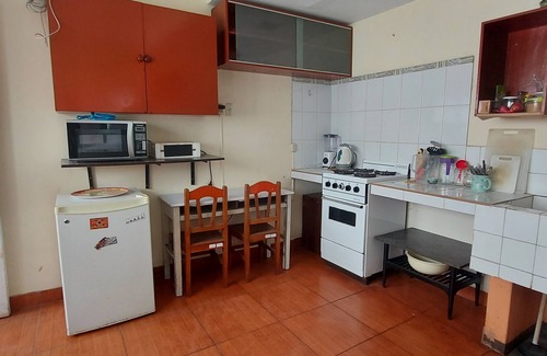 Miraflores House | 10 minutes walking from Kennedy park. Access to a kitchen and a terrace.