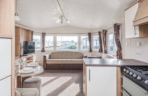 Maryport House | 12ft-wide quality caravan with one double and two twin.