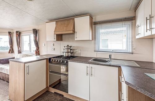 Maryport House | 12ft-wide quality caravan with one double and two twin.