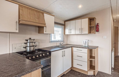 Maryport House | 12ft-wide quality caravan with one double and two twin.