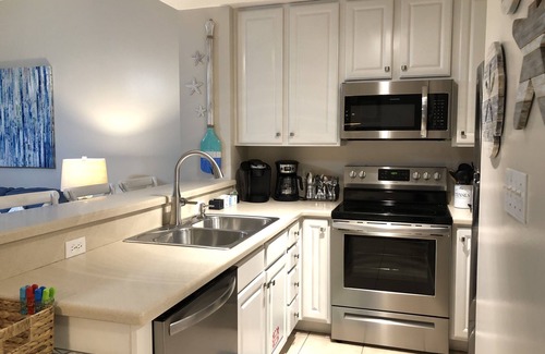Lower Grand Lagoon Condo | 1st FLOOR UNIT - steps to the beach and pool! Book for the Fall season!