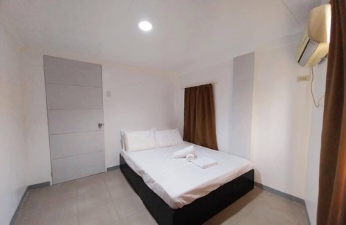 Suba Basbas House | 3-Bedroom Pacific Grand Townhome in Masulog, Lapu-Lapu with WiFi & Full AC Rooms