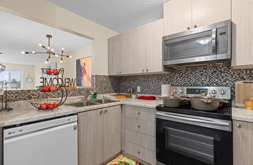 Northeast Edmonton Apartment | 3rd Floor View With Balcony Facing Green Field. Slps 5. Spacious and Stunning