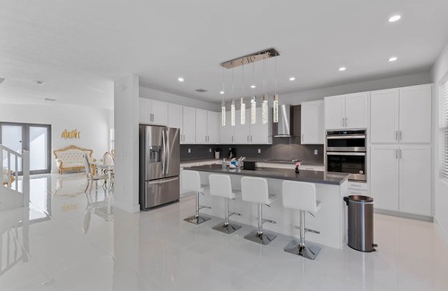 Ludlam Villa | 4BR/4BTH Miami Oasis: Stylish Retreat w/BBQ & Trampoline - Near Beach & Airport