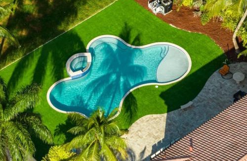 Dania Beach House | 5000 Square Ft Beautiful Mansion w 6br Hot Tub Playground Movie Theater & Game Room