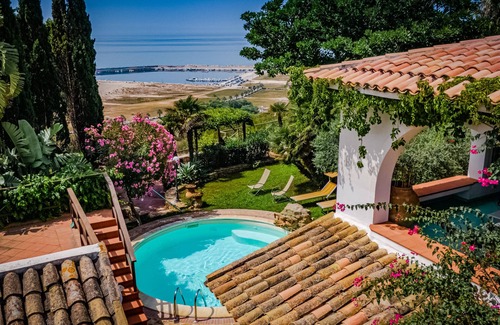 Porto Palo Villa | A balcony on the beach, pool, lush park
