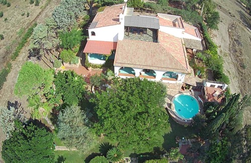 Porto Palo Villa | A balcony on the beach, pool, lush park