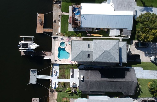 Flor-a-mar House | A bit of Key West in New Port Richey: Bright Home w/Pool & Boat Dock Access!