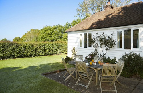 Wittersham Cottage | A charming, detached, weather-boarded cottage, set in a secluded location on the edge of the histori