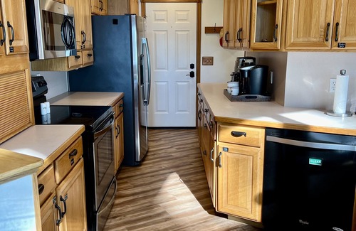 Cokato Cabin | A Creek Runs Through It & Garage Great Room