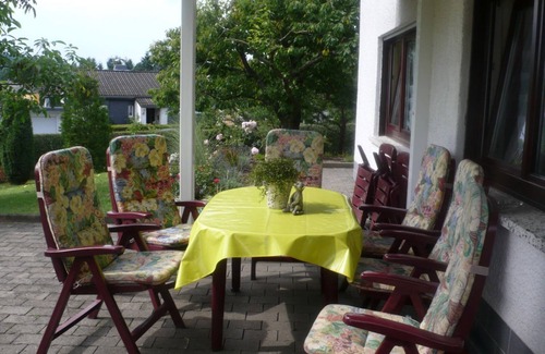Schoffengrund Apartment | A lawn and a terrace invite you to linger and relax.