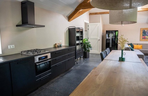 Ermelo House | A luxury group accommodation in which you can spend a nice time with your family or group of friends. This large robust house accommodates everyone, has a spacious living room, and has 8 bedrooms and 4 bathrooms.