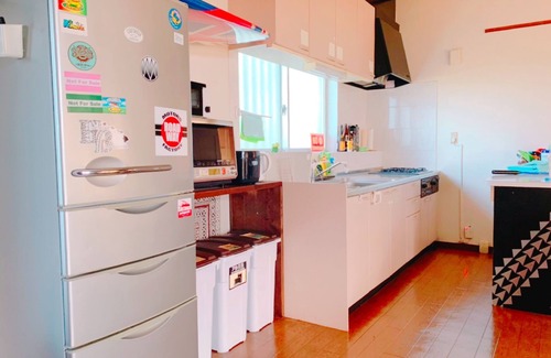 Namihira House | A panoramic ocean view beyond the sugar cane field