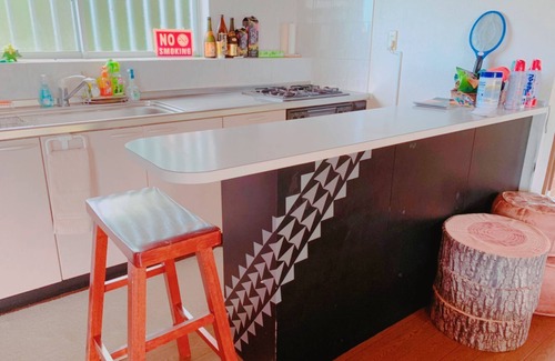 Namihira House | A panoramic ocean view beyond the sugar cane field