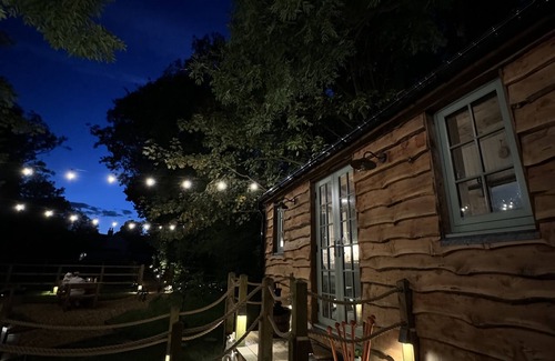 Warrington Cabin | A peaceful countryside retreat with a private hot tub and cozy log burner.