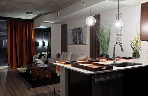 Midtown Apartment | A Place of Peace: Discover serene comfort in a peaceful retreat! This centrally located property provides easy access to top corporations, popular attractions, stadiums, & dining hotspots.