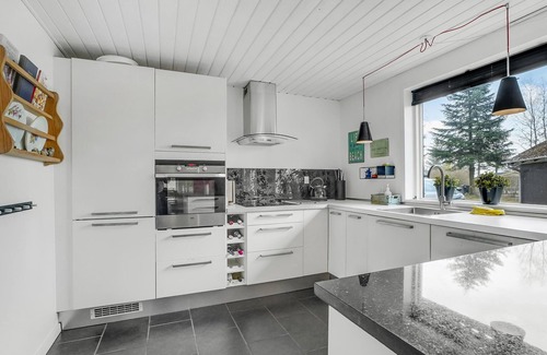 Hojslev House | A stylishly decorated cottage with a cozy ambience.