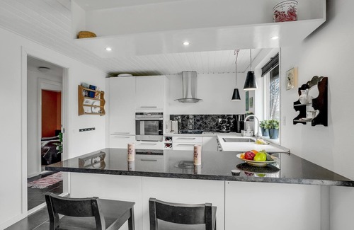 Hojslev House | A stylishly decorated cottage with a cozy ambience.