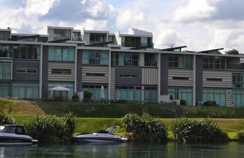 Taupo Apartment | Absolute waterfront apartment. Stunning river views. Swimming pool and kayaks.
