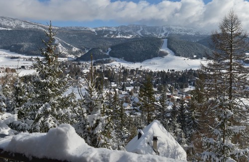 Les Lolettes Ski Chalet | Adorable chalet perched in the forest with breathtaking views of the ski area.