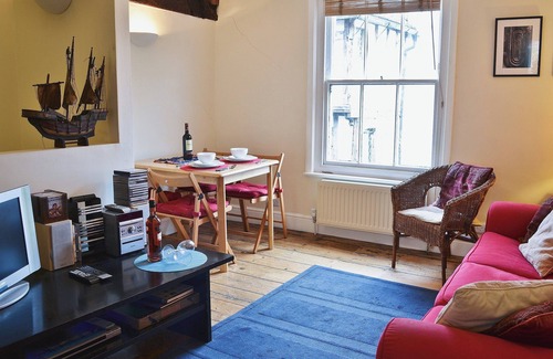 Rye Cottage | An unusual two-storey apartment with beams and an open fire.
