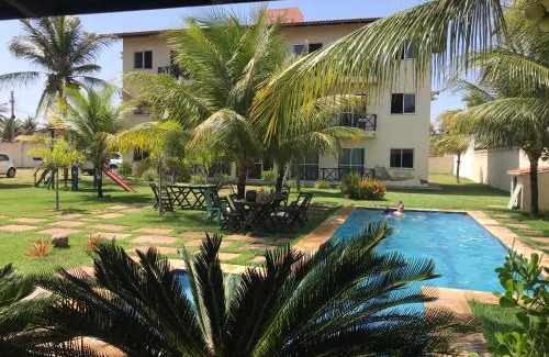 Taiba Apartment | Apartamento com vista para o mar, piscina , deck , playground e estacionamento .