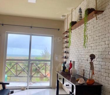 Taiba Apartment | Apartamento com vista para o mar, piscina , deck , playground e estacionamento .