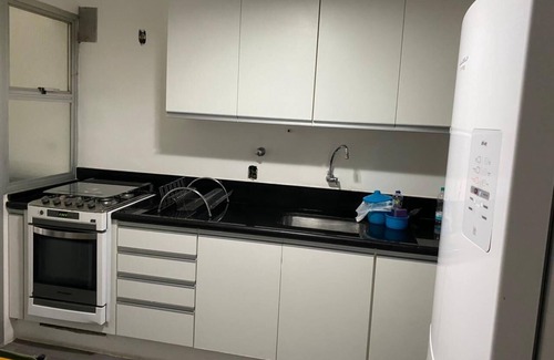 Parque Enseada Apartment | Apartment in Enseada - 2 suites + 1 bedroom with air conditioning and WIFI