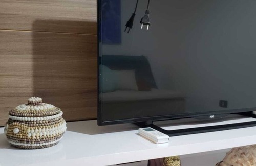 Umuarama Apartment | Apartment in the center of Ubatuba, view of the sea on the horizon