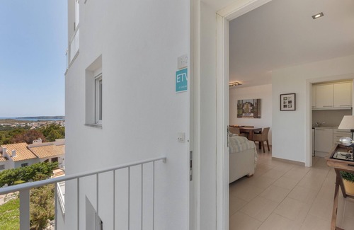 Coves Noves Apartment | Apartment 'Infinity View Menorca' with Sea View, Shared Pool and Private Terrace