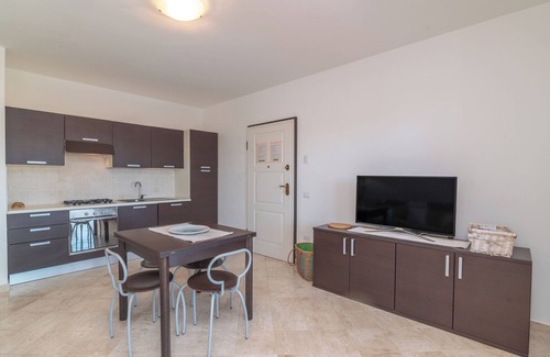 Porto Pozzo Apartment | Apartment 'Il Fiordo 16' with Sea View, Shared Pool and Air Conditioning