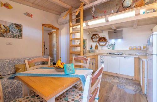Trinita d'Agultu e Vignola Apartment | Apartment 'Perla Marina' with Balcony, Wi-Fi and Air Conditioning