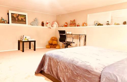 North Glenmore House | Artistic and stylish english charm backyard private guest house with master bedroom and living room