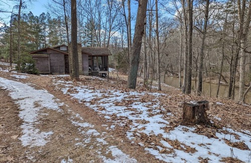 Harrisonville Cabin | Backyard creek, screened porch