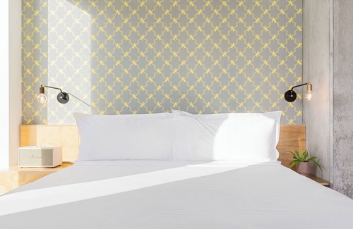 East Cesar Chavez Hotel | Balcony Room at Arrive Austin, City Views, Pets Are Welcome!