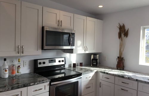 Cherry Grove House | Bayfront Fun! - 3 BR and 3 Ensuite Bath with Hot Tub!