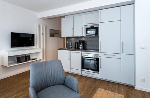 Bensersiel Apartment | Beachfront apartment with large balcony, parking, use of swimming pool & sauna -