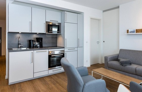 Bensersiel Apartment | Beachfront apartment with large balcony, parking, use of swimming pool & sauna -