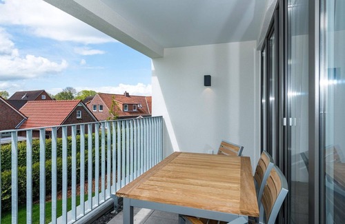 Bensersiel Apartment | Beachfront apartment with large balcony, parking, use of swimming pool & sauna -