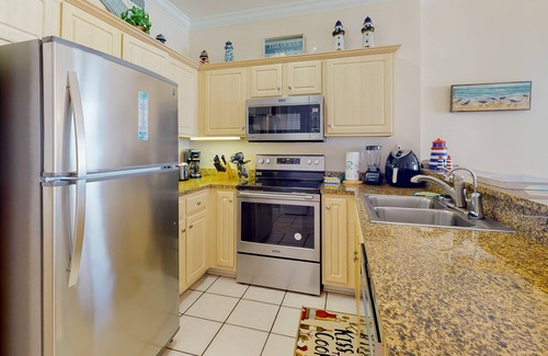 Gulf Shores Condo | Beachfront corner condo with amazing Gulf views, balcony, pools & hot tubs
