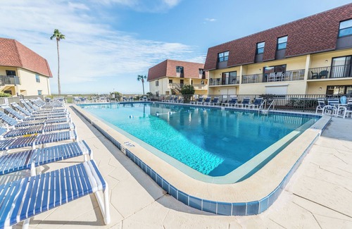 Avon By The Sea Condo | 🌴Beachfront Family Retreat: Pool, Private Balcony & Walk to the Pier