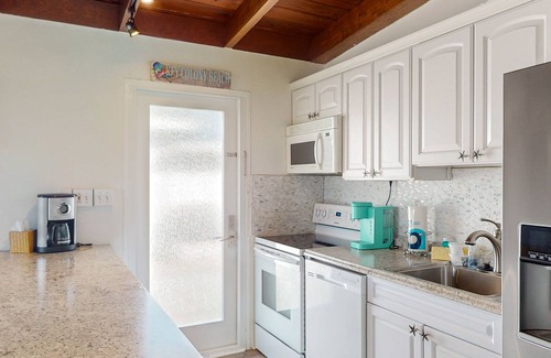 Key Colony Beach Cottage | Beachy getaway with pool, water views, furnished patio, & dock access