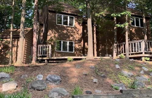 Maple City Condo | Beautiful & cozy condo with private wooded view deck @ The Homestead Resort