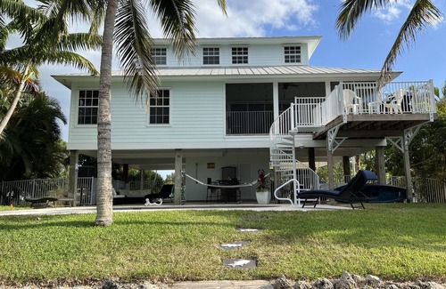 Pine Island Center House | Beautiful waterfront Key West style home with a pool