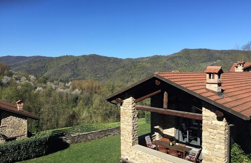 Pezzolo Valle Uzzone Apartment | Beautifully Restored Apartment in Farmhouse with Swimming Pool and Woodland