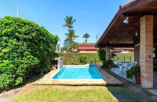 Praia Grande Villa | BH4 · BH4: CASA COM PISCINA AO LADO DA PRAIA GRANDE