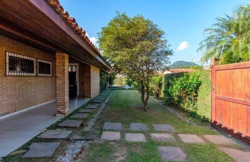 Praia Grande Villa | BH4 · BH4: CASA COM PISCINA AO LADO DA PRAIA GRANDE